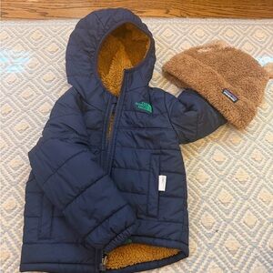 The North Face Blue Jacket with Tan Fleece Hat